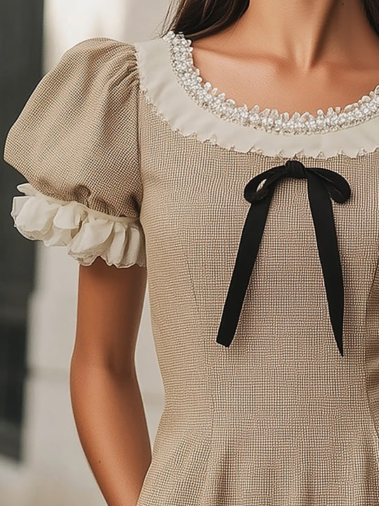Stylish Beige Mini Dress With Puffy Sleeves And Classic Bow Detail